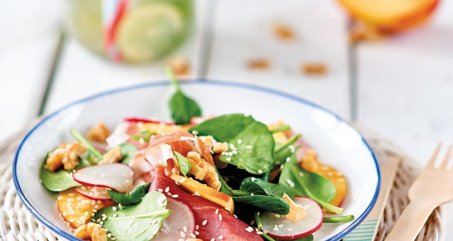 Baby spinach, nectarine, radish, Parma ham and walnut salad