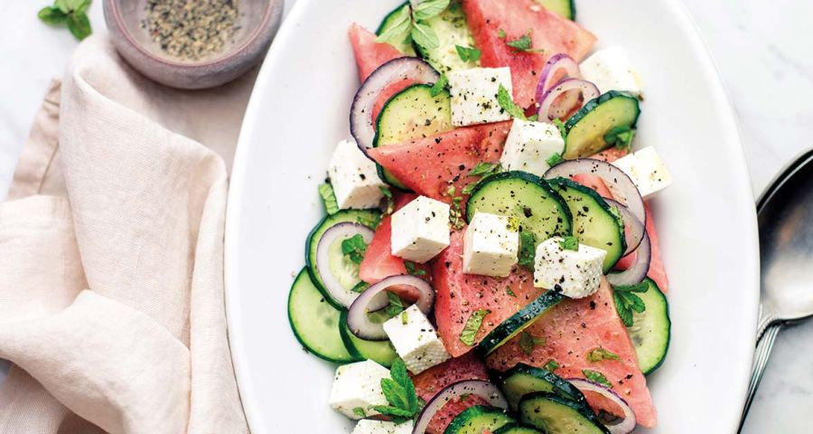 Watermelon salad with cucumbers and primosale cheese