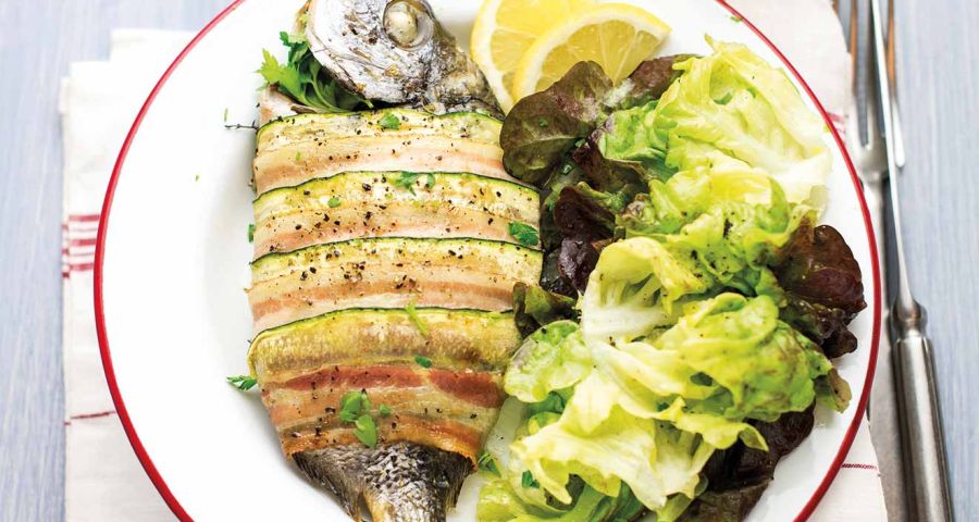 Sea bream wrapped in courgette and bacon with a mustard salad