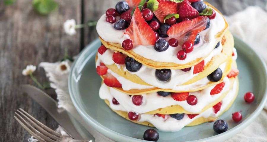 Pancakes with cream and berries