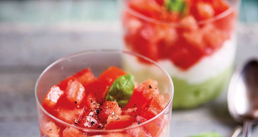 Small glasses of feta, avocado and tomato